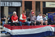 Veterans sitting on float in parade
