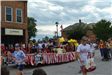 People on float and walking in parade
