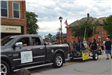 Truck pulling trailer in parade