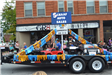 Float of kids cars on trailer in parade
