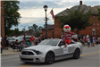 Brutus Buckeye sitting in car in parade
