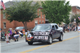 Truck with banner in parade