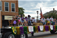 People sitting on float in parade
