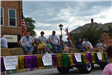 People sitting on float in parade