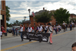 People holding banner walking in parade