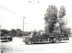 Older Firetruck Next to Tree