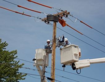 People Working on Telephone Pole