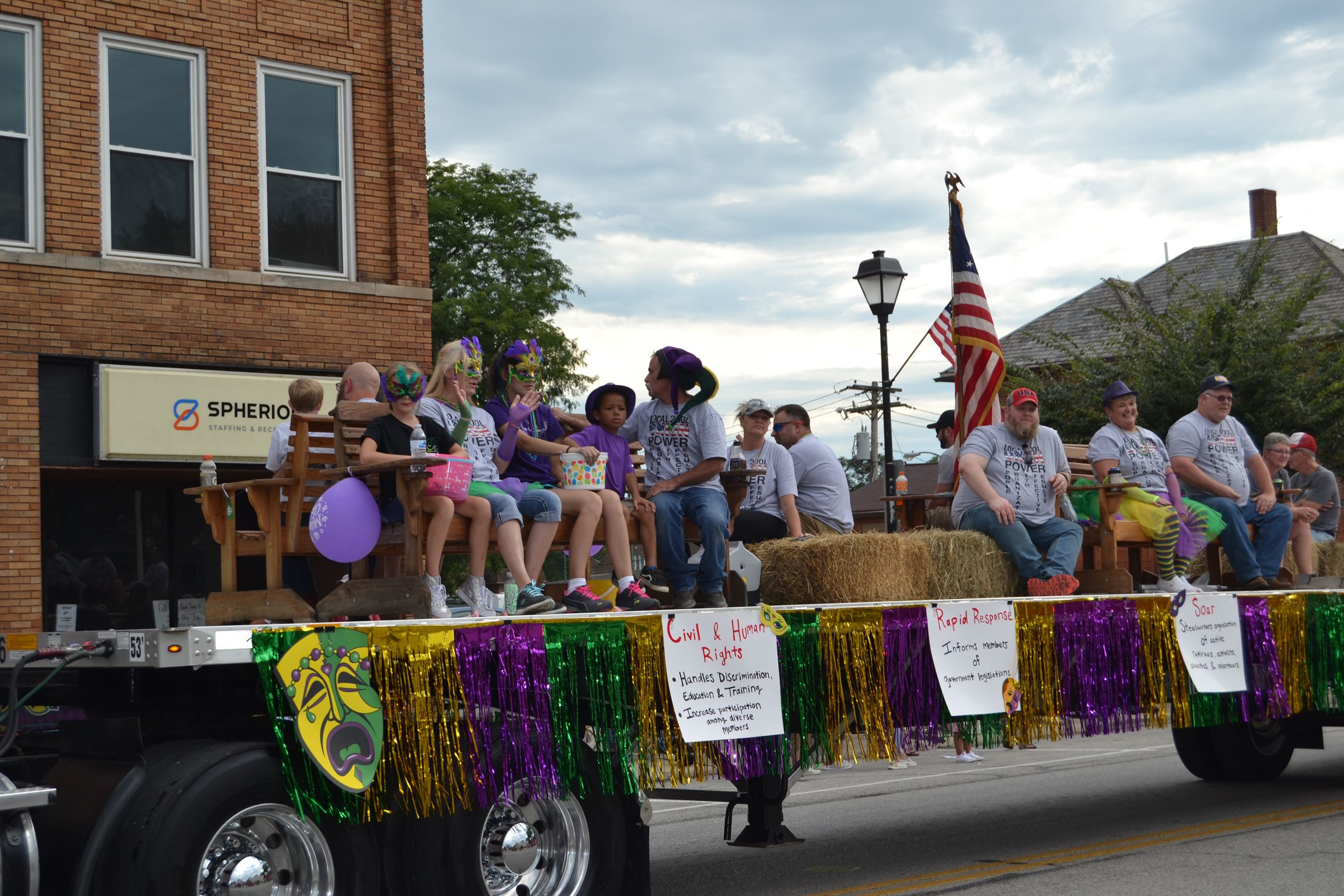 People sitting on float in parade