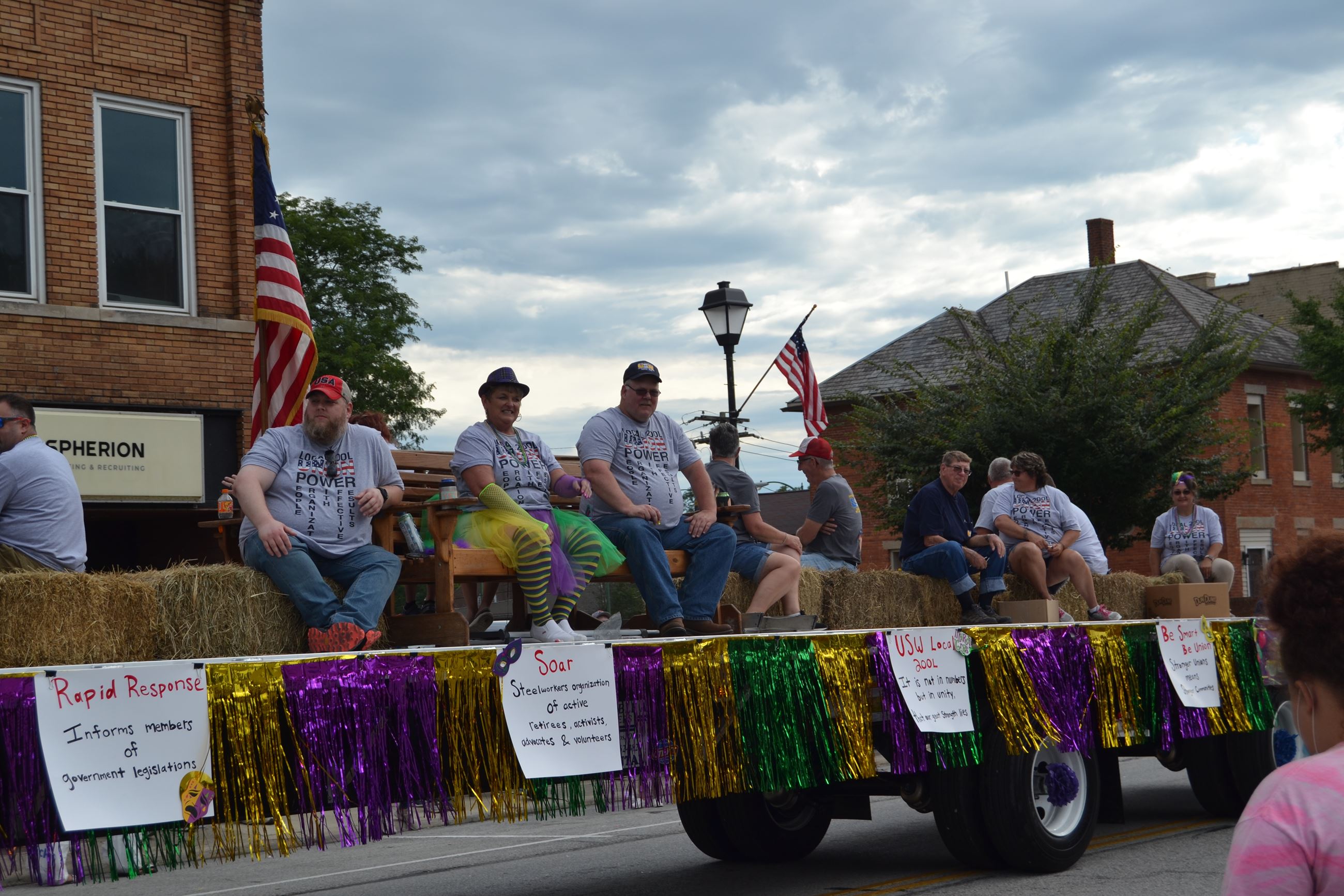 People sitting on float in parade