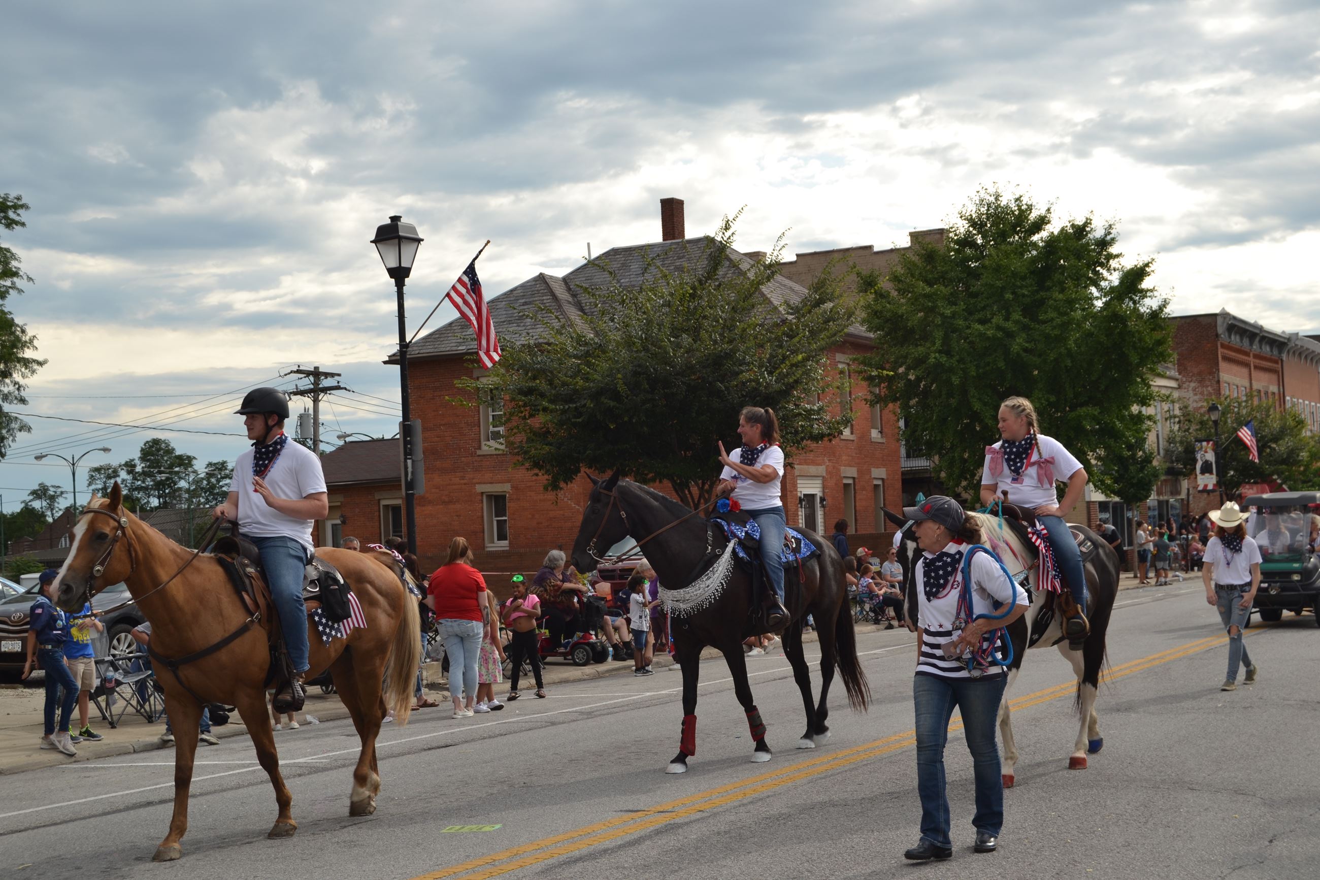People riding horses in parade