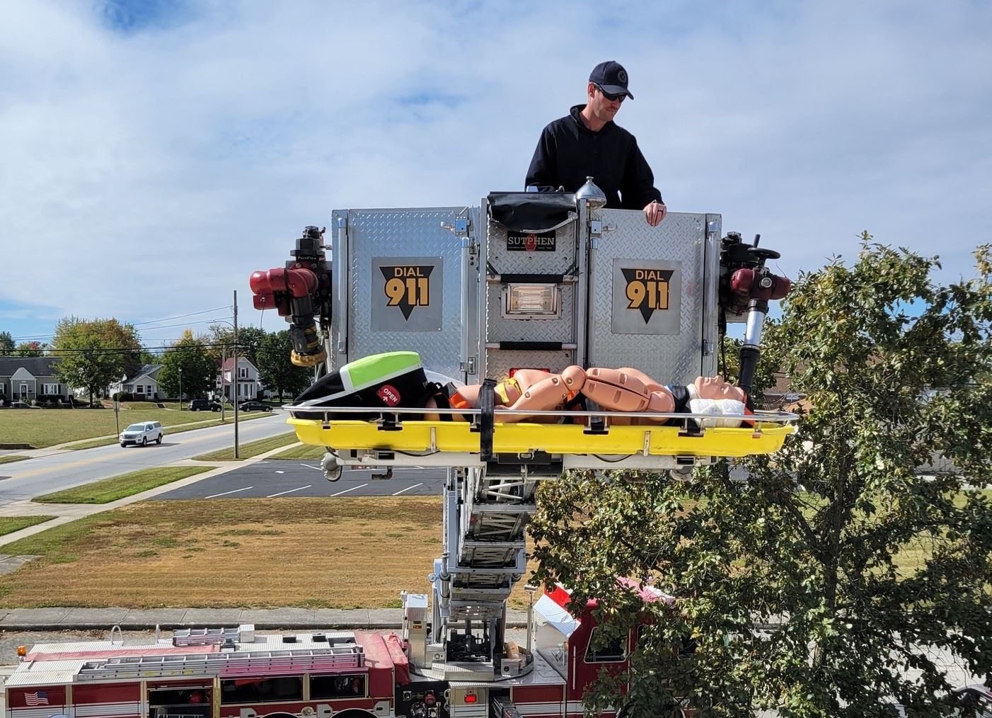 Firefighter in bucket of truck